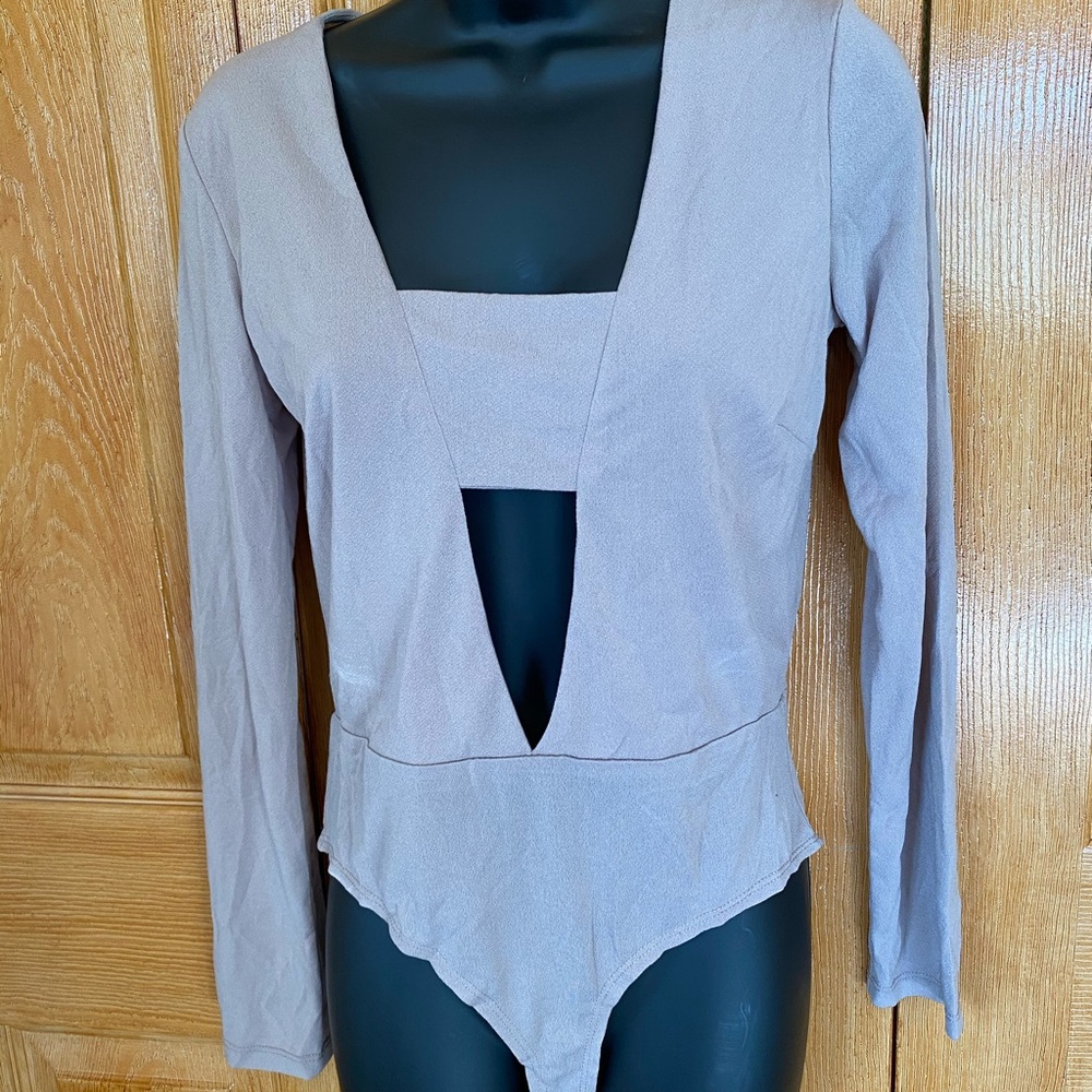 Light tan bodysuit.